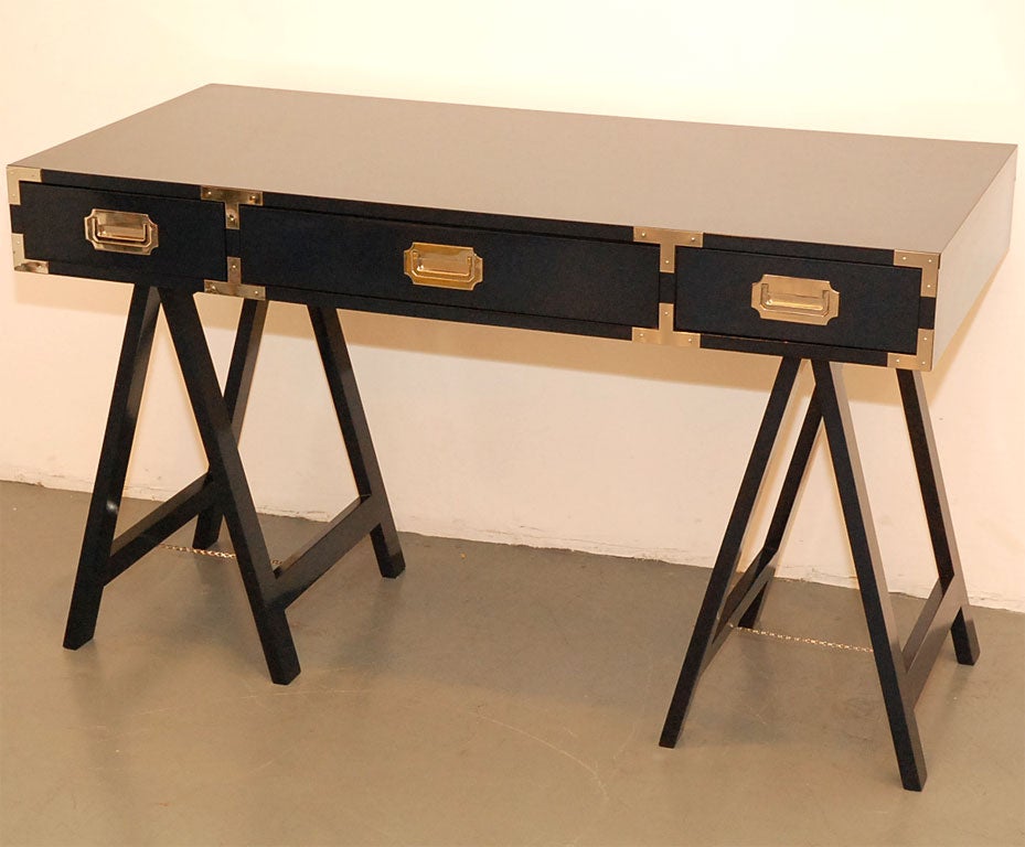 Navy blue lacquered campaign desk with chrome hardware.   Perfect for a writing desk.