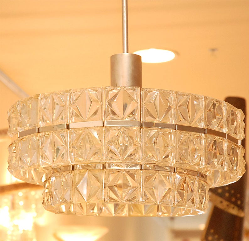 Art Deco chandelier with 3 tiers of crystals cut in squares with chrome hardware.  Professionally rewired.