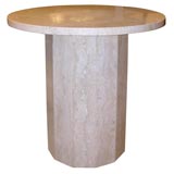 Round travertine side table