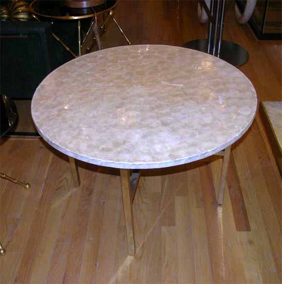 Pair of capiz shell veneer circular top side tables on straight brass legs with cross stretchers.  Designed by Billy Baldwin.