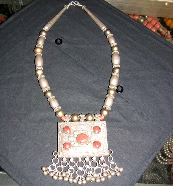 Yemeni Tribal Necklace in silver with gold-wash beads and coral inset.

JC - 5