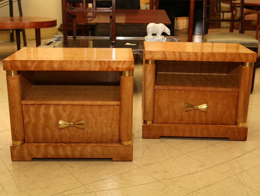 Pair of tiger maple night stands with polished brass pulls.