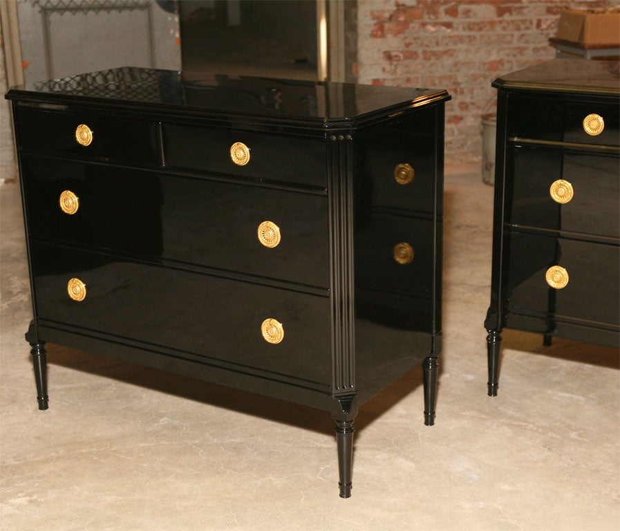 A great pair of black lacquared steel commodes in the Louis XVI style with chased gilded bronze pulls.The pair of commodes are very chic and done to the highest standards. We attribute them to Mason Jansen based on the guality of work and the firms