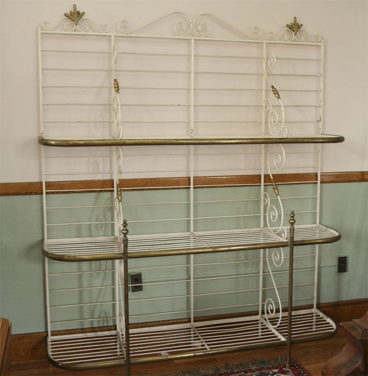 This bakers rack is very suitable for a large country kitchen or comercial establishment.The size gives one lots of usable shelving. Its fixed open work racks also have glass shelves cut though they are not shown in the photos.