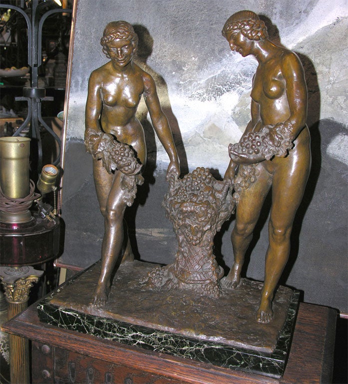Art Deco bronze sculpture by L. Dolapehier on a dark green marble base.