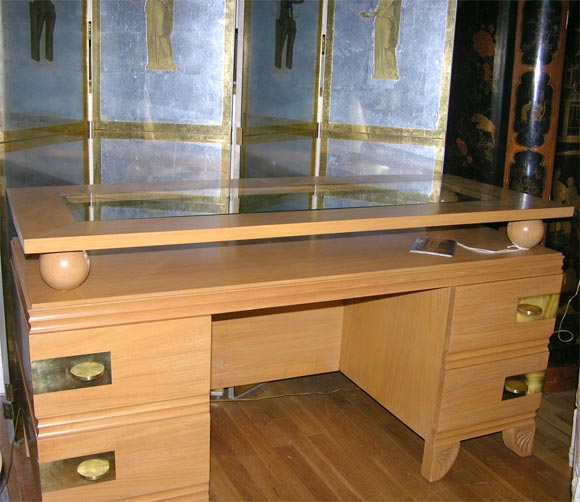 An American Neo-classic design walnut dressing table/desk with top having inset glass surface supported by four ball supports and with four drawers with fitted interiors having polished bronze Neo-classic design pulls and Grecian inspired Athenaeum