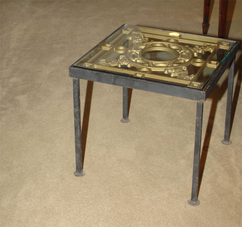 Glass top iron and brass table