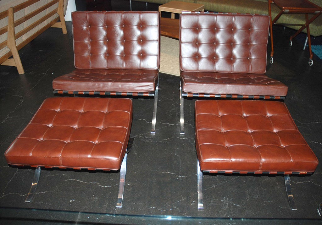 These brown leather chairs (ottomans are sold) designed by Mies van der Rohe are in excellent original condition. The leather is soft and has no cracks or tears in straps or leather cushions.