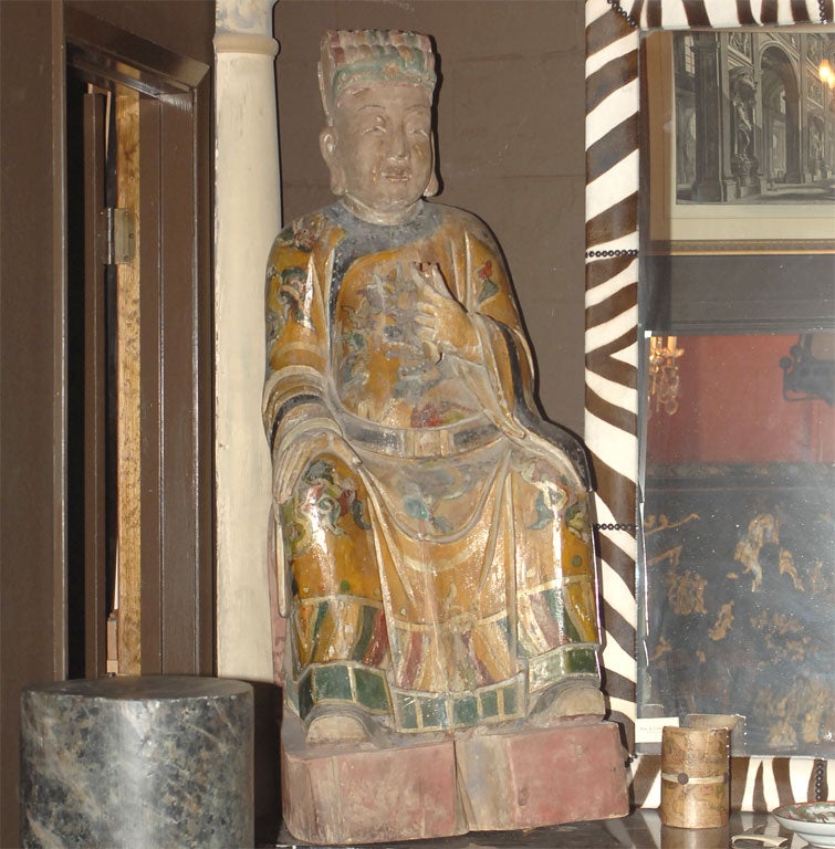 A Qing Dynasty Painted and Carved Wood Deity Figure