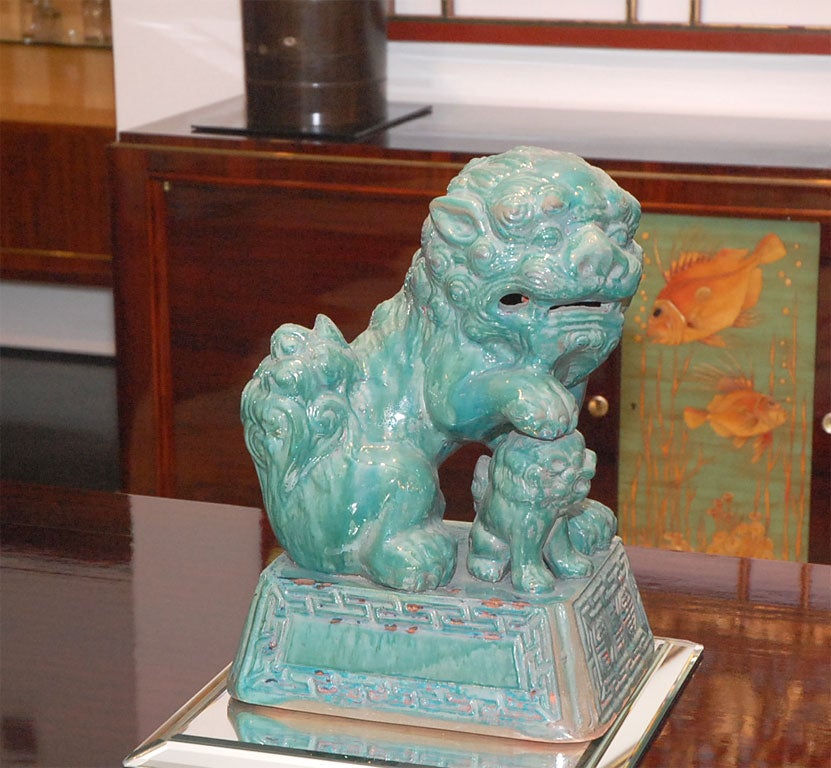 Ceramic foo dog in turquoise glaze by Tony Duquette.