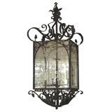 A Massive Baroque style Iron, Tôle and Glass Lantern-