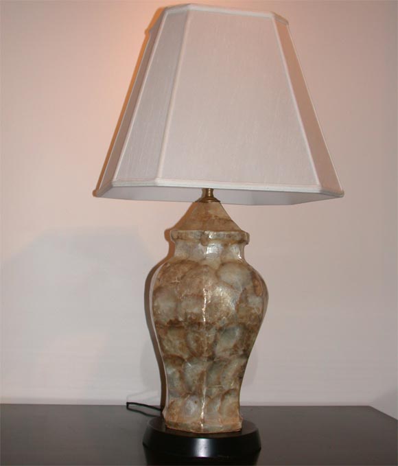 Beautiful capiz shell lamp monted on a wooden base newly rewired with double cluster and silk shade.