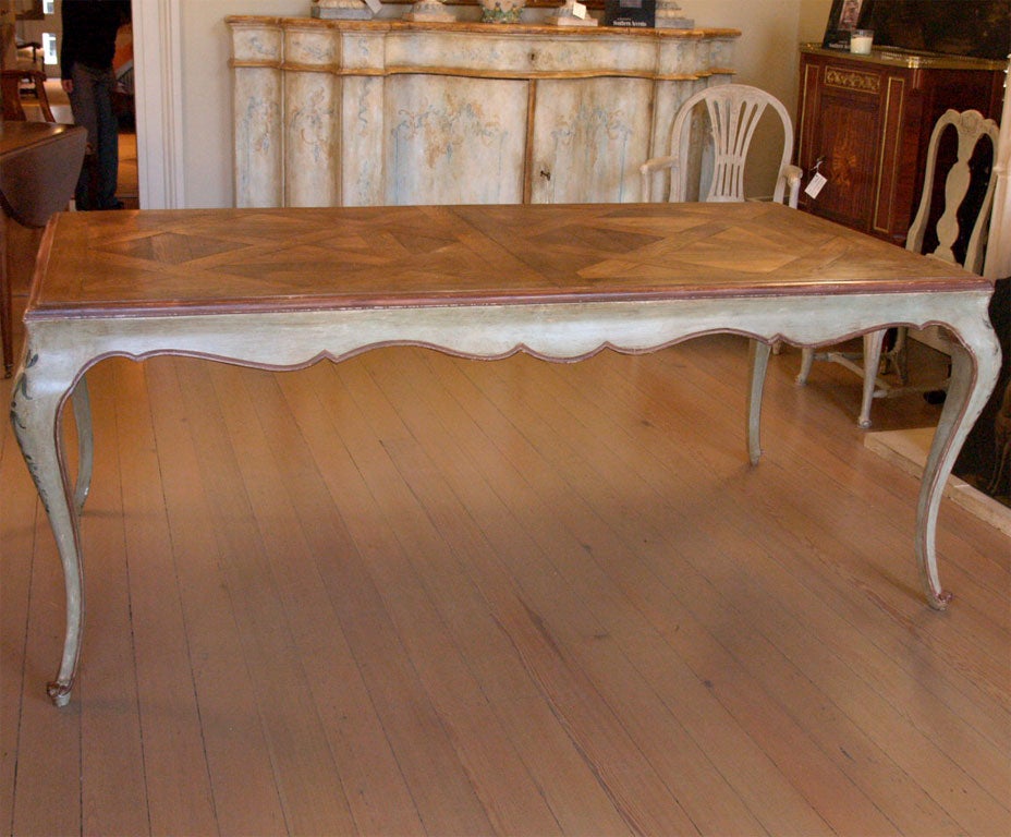Louis XV style painted dining table. Parquet wood top is reclaimed antique flooring.