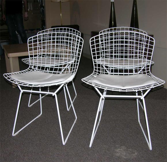 white metal chairs with white leather pads