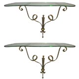 A Pair of Art Deco Parcel-Gilt Steel and Glass Consoles