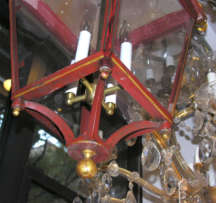 red hall lantern with distressed gold embellishments.