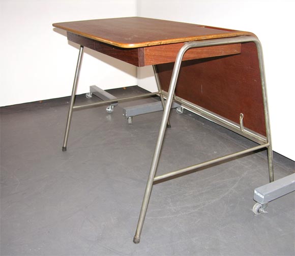 One of 18 made. In 1955 Arne Jacobsen was commissioned to architect the Munkesgaard school and design all of it's furniture and fixtures including 18 teacher's desks, students desks, chairs, lighting and PA system. The furniture pieces were produced
