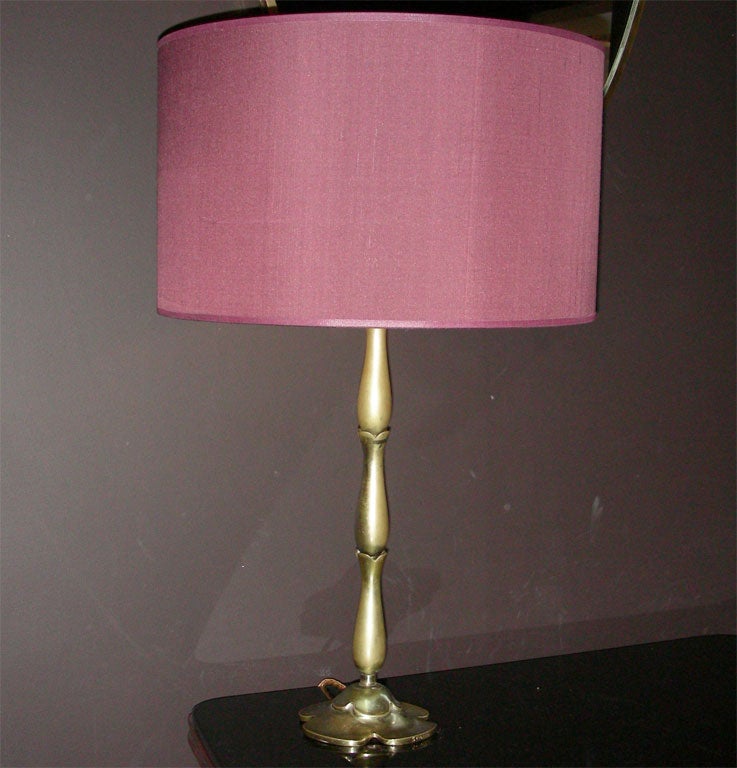 A gilt metal table lamp stamped Scarpa
