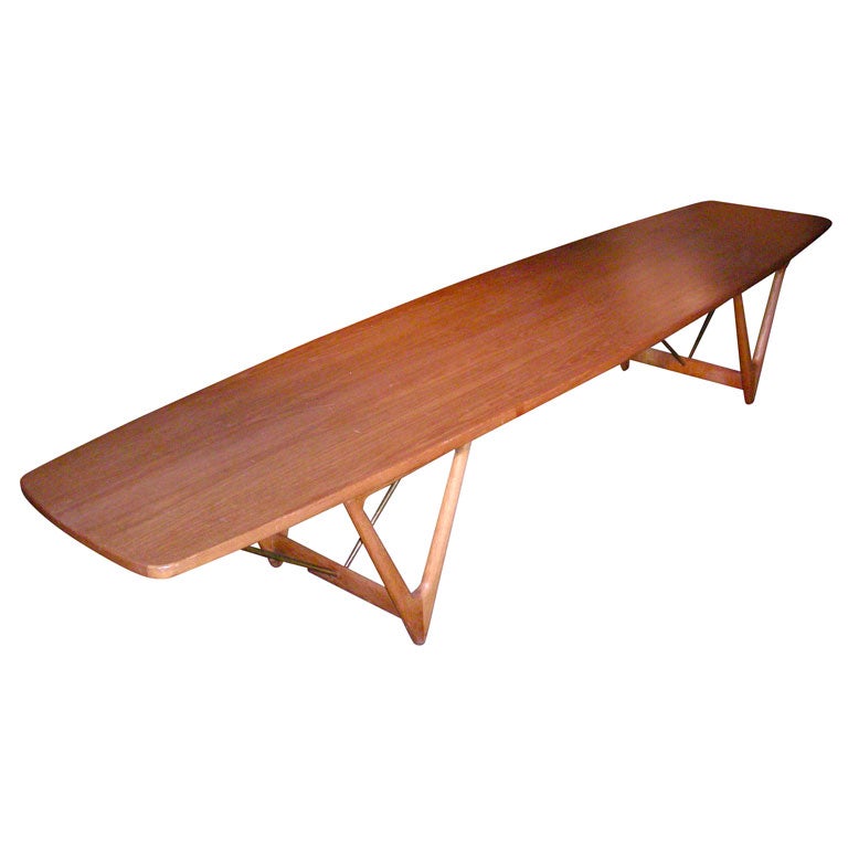A teak and metal 
surfboard
 table