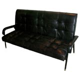 black leather sofa designed by jacques adnet