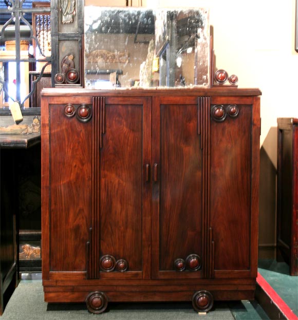 Exceptional Chinese Deco bar/vanity of blackwood and rosewood with old spoiled mirror. Interior shelves glide on original mechanisms. Excellent Chinese deco example with very slight crack on top and minimal separation of top front right corner from