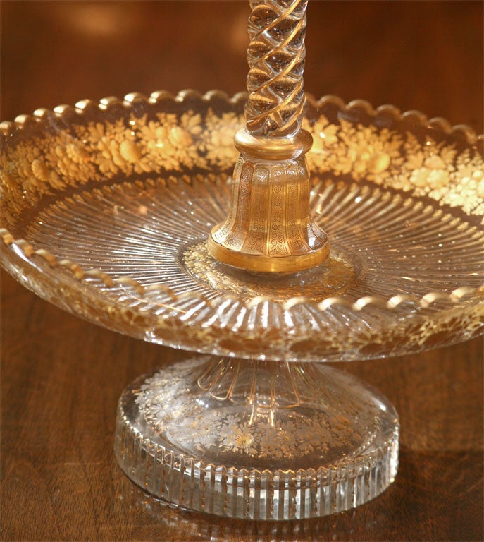 A 19th century Baccarat hand blown crystal epergne with intaglio floral cut decoration with parcel gilt enamel. The amazing workmanship on this tall and impressive centerpiece is made in 2 parts with the center trumpet easily removed for easy