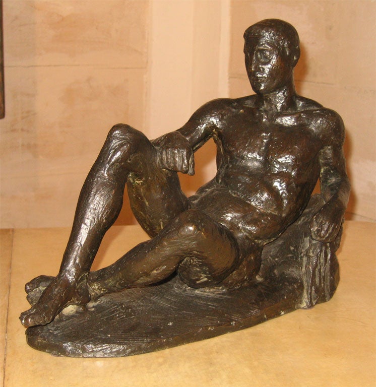 1931 bronze statue of a man lying on his side, signed and dated by Athanase Apartis, disciple of Bourdelle. Mark of the foundry: Valsuani.