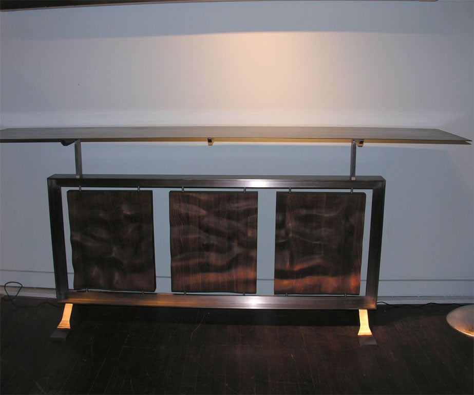 Steel and Walnut Table of Superior Craftsmanship.  Hand Welded Steel T-Bar Frame, and Platypus Feet.  Floating, Patinated Cold-Rolled Steel Top. 3 Suspended Panels of Uniquely Hand Sculpted Walnut, Rubbed and Oiled.  