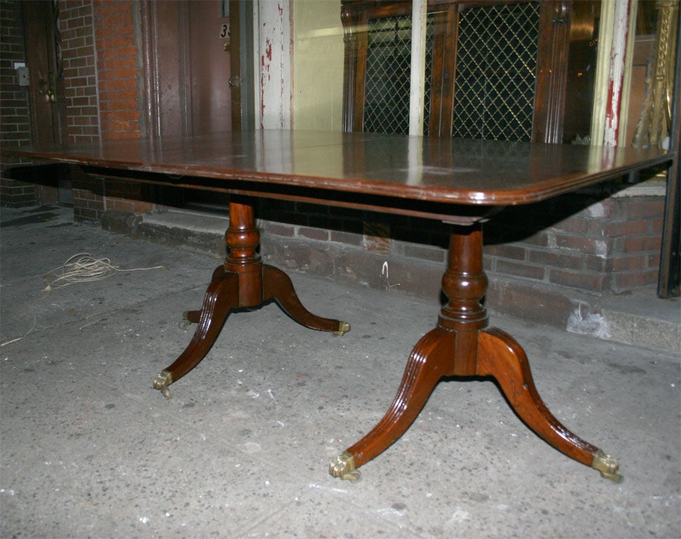 A rather fine antique English mahogany 2 pedestal table of generous proportion  cross banded in yew wood with 4 20
