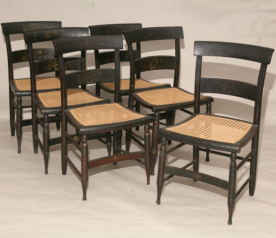 Set of 6 matching Hitchcock style side chairs.  Original black painted finish with original decorative gold stenciling.  Hand caned seats.