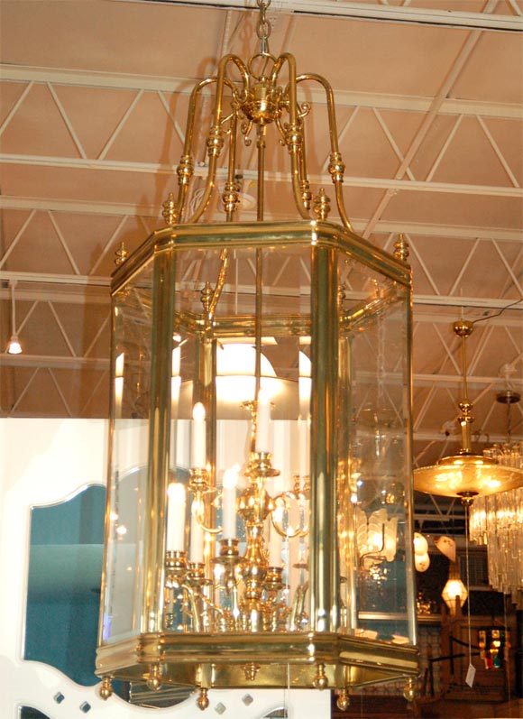 Huge and well proportioned hall or stairway chandelier by Baldwin Brass Company and dating to the 1970's.  Made of solid brass, not plated and extremely heavy.  Beveled glass panels, original ceiling canopy included. 24 HOUR HOLD ONLY.