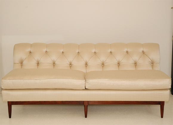 A beautiful Silk upholstered banquette with 2 loose seat cushions.  The frame is exposed on the back and features a double 