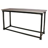 A Brass and Travertine Console, attributed to Jansen.