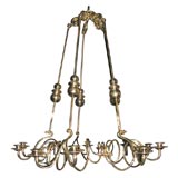 Polished brass swirl ten-light counterweight chandelier