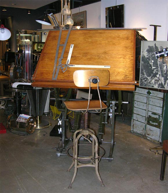 A mid 19th Century Iron and Wood architect's drafting table made by Jerome Hurych, with a drafting device probably added later. The two pedal mechanism has 