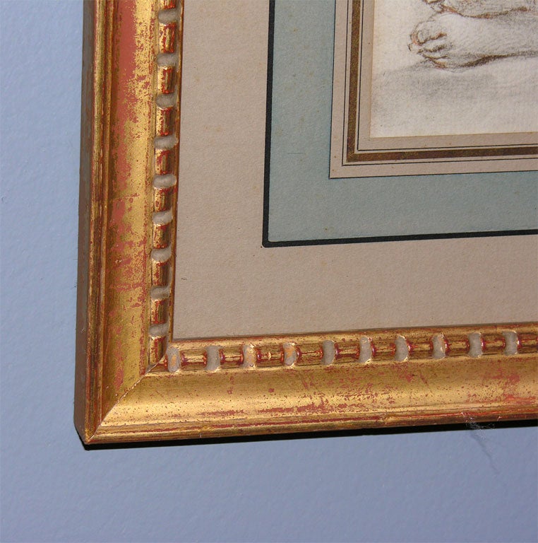 A beautiful print of nude and cherub, French matted in a giltwood frame.