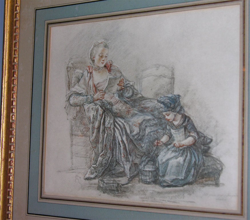 A beautiful print of mother and child, French matted in a giltwood frame.