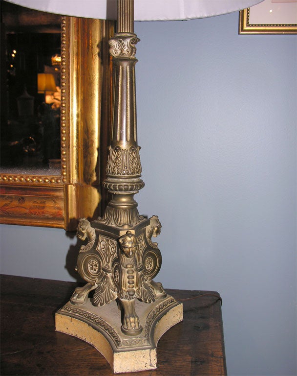 A pair of metal classical style lamps.