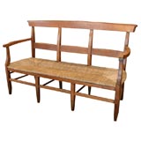 Antique French provincial rush seat fruitwood bench.