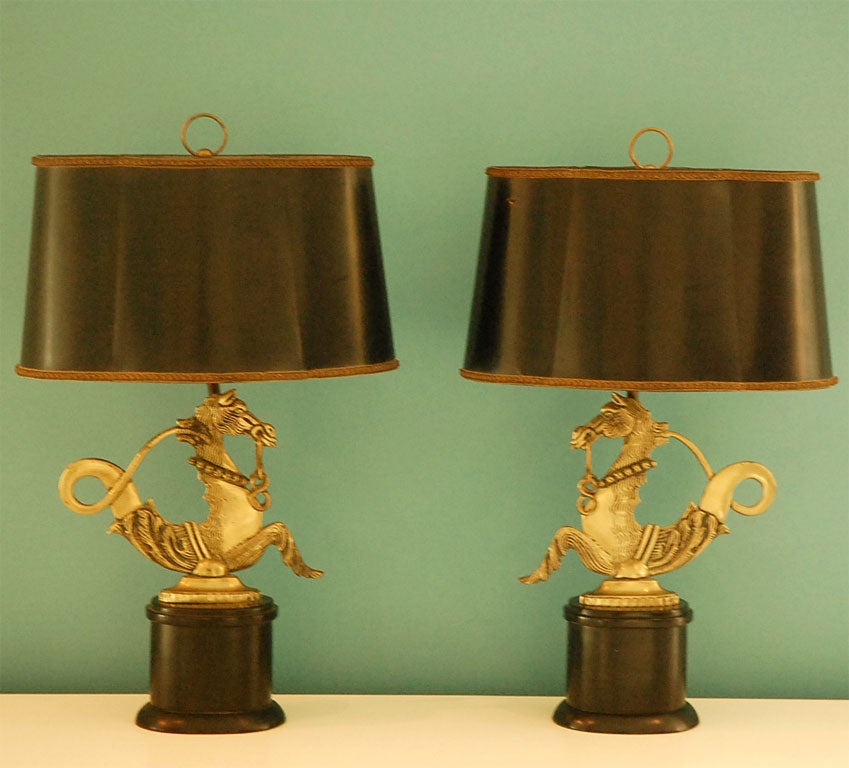 Pair of elegant seahorse lamps with black lacquered bases and vintage black leather shades.