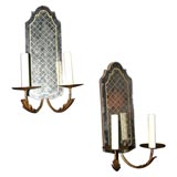 Etched gold lattice mirrored back pair of two light sconces.