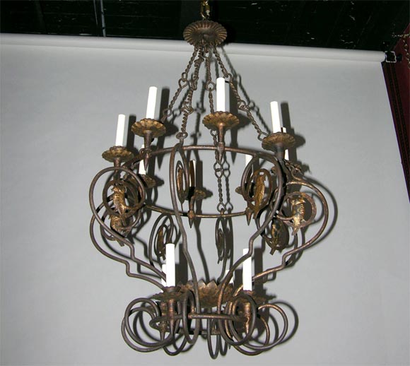 Forged iron twelve light chandleier with bird motif.