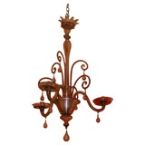 A LIGHT WINE COLORED THREE LIGHT MURANO CHANDELIER