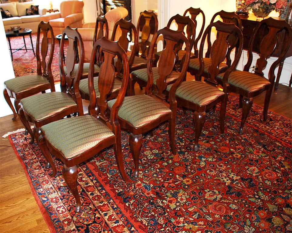 A Northern European Mahogany Dining Room Table with 12 Chairs 1