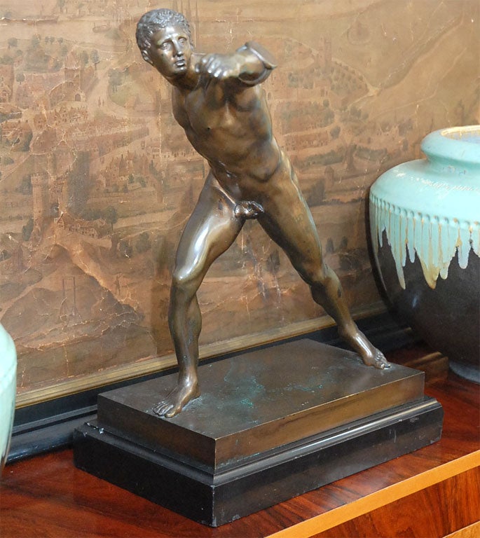 An exquisitely naturalistic figure of the bronze warrior in action. It rests on a black marble fitted base. Great sculpture and artist model.