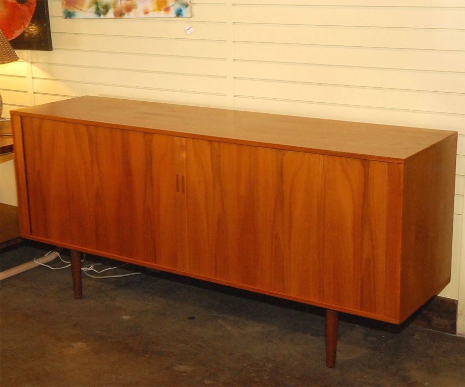 Long teak sideboard with 2 big files cabinets, 4 drawers and 1 shelf. Perfect for an office or to hide an office.