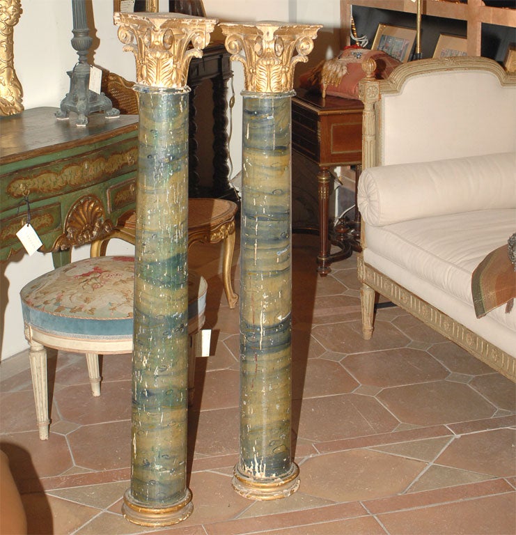 Pair of nineteenth century faux-marble painted and gilt wood columns from Italy