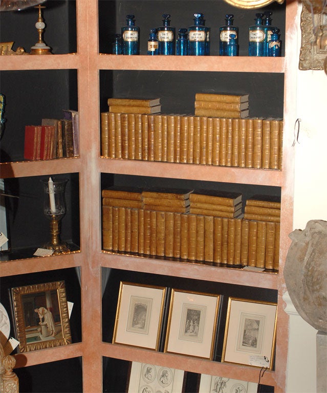 Eighty leather bound volumes representing the complete works of Voltaire - early nineteenth century