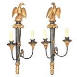 Pair of Empire Style Parcel Gilt and Ebonized Two Light Scones