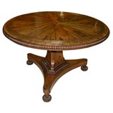 A Fine Regency  Brass-Mounted Rosewood Tilt-Top Center Table